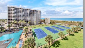 A hotel with multiple floors, a pool, tennis courts, and a beach view. - Amazing 7th floor beachfront condo wonderful views (South Padre Island)