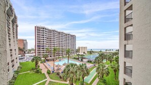 A hotel with multiple floors, a swimming pool, and a tennis court. - Amazing Saida beachfront 2 steps from amenities (South Padre Island)
