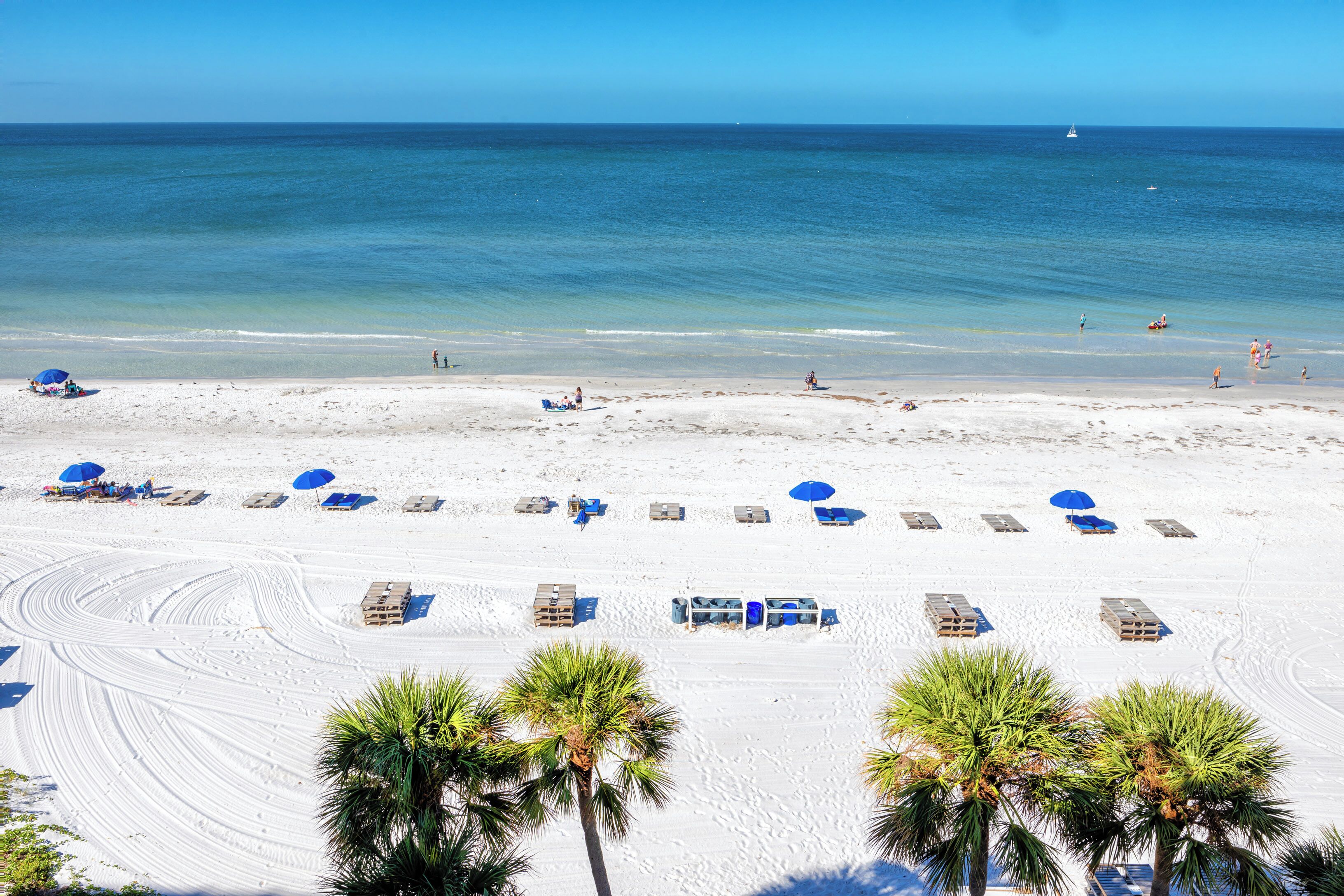 On the beach, sun loungers, beach towels