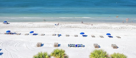 On the beach, sun loungers, beach towels