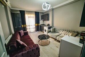 Classic Apartment | Living area | 72-cm plasma TV with cable channels - Suit Travel (Istanbul)