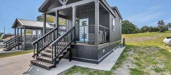 Cottage with Loft - Pet Friendly - Includes 3 queen beds (one in master and 2 in loft), a fully equipped kitchen, dining area, private bath and shower, TVs, Wifi, all utilities, access to all resort amenities. This cottage is pet friendly.