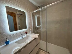 Hair dryer, towels, soap, shampoo