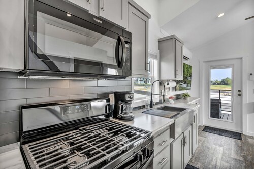 Cottage with Bunk Beds - Includes 1 queen bed in the master, 2 bunk beds and 1 queen bed in the loft. A fully equipped kitchen, dining area, private bath and shower, TVs, Wifi, all utilities, access to all resort amenities. This cottage is pet friend