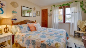 A bedroom with a bed, a chair, a lamp, and a window with curtains. - Harmony Home w/ Fire Pit: 5 Mi to Niagara Cave! (Harmony)