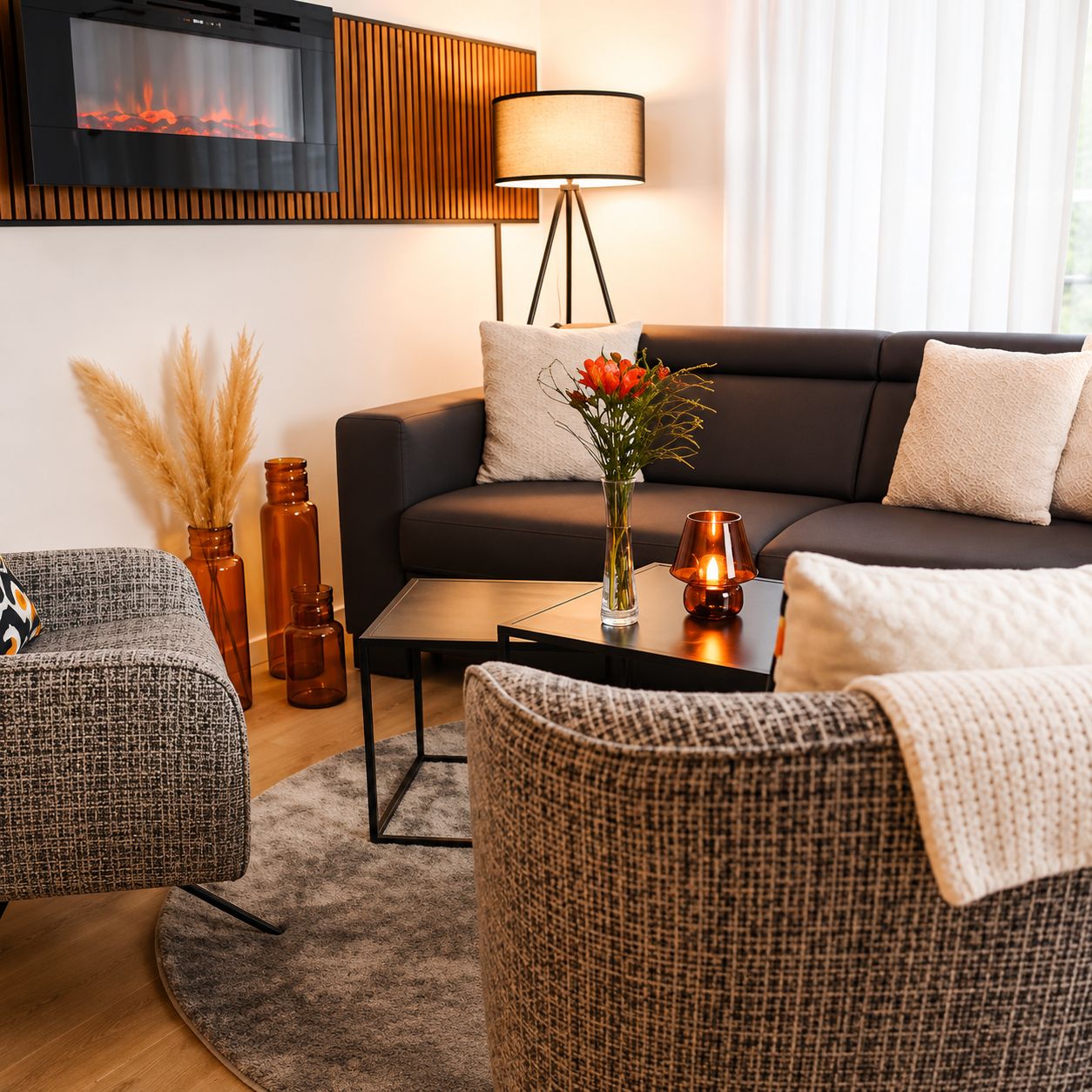 A modern living room with a sofa, coffee table, and decorative items.