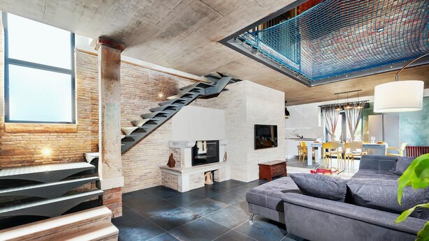 A spacious living area with a staircase, a fireplace, a dining area, and a large window. - Amazing home in Kanfanar (Kanfanar)