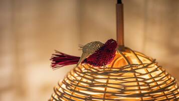 A woven lamp with a tassel hanging from it.