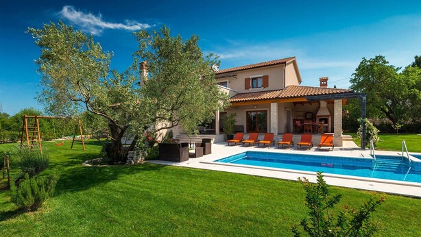 A two-story house with a swimming pool, outdoor seating, and a garden. - Amazing home in Salambati (Salambati)