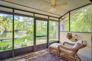 Enjoy the serene view of the natural landscape from the comfort of this cozy space.