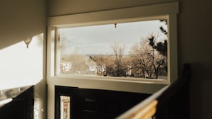 A view from a window with a view of trees and houses. - Rims view pet friendly home  (Billings)