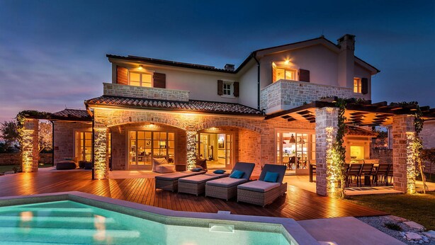 A two-story house with a swimming pool, outdoor seating area, and stone pillars. - Awesome home in Porec (Porec)