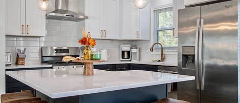 Coffee/tea maker, fridge, microwave, oven