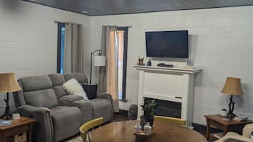 Smart TV, fireplace, DVD player, books