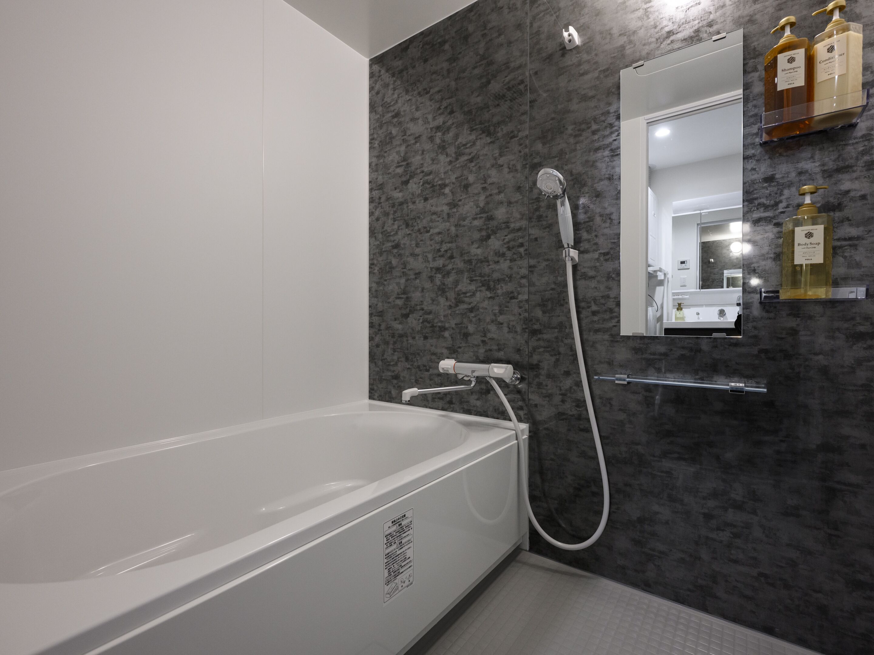 Separate bathtub and shower, free toiletries, hair dryer, slippers