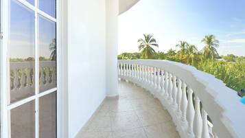 Deluxe Room, Balcony, Pool View | Individually decorated, individually furnished, desk, laptop workspace