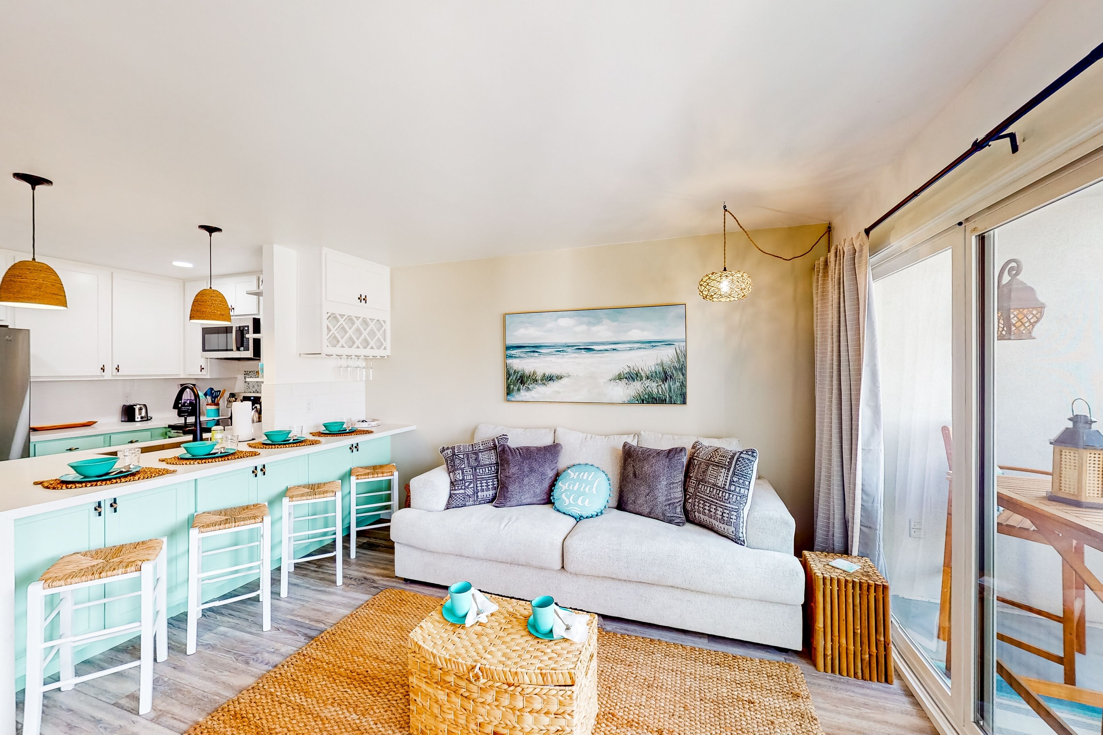 Sound view condo with modern interior, gas fireplace, balcony, & W/D access