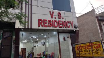 A building with a sign reading "V.S. RESIDENCY".