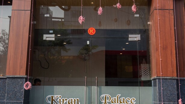 A building with the sign "Kiran Palace" above the entrance. - Kiran Palace Varanasi (Varanasi)