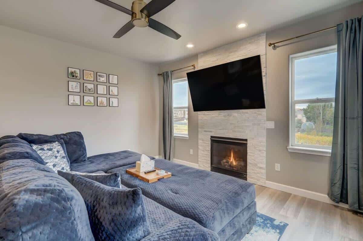 Stay Cool with a Ceiling Fan, Stay Powered with Convenient Outlets, and Relax in Style with Beautiful Furnishings in This Area.