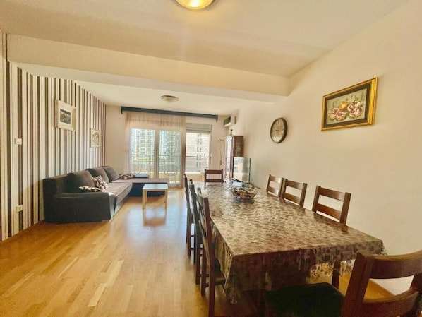 Comfort Apartment | Living area | 32-inch LCD TV with cable channels