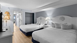 A hotel room with two beds, a desk, and a wardrobe. - Magnificent Oceanfront Ste 14th Flr w/Breakfast (Myrtle Beach)
