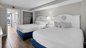 A hotel room with two beds, a walk-in closet, and a view of the ocean. - Beachy Oceanfront Ste with Breakfast 14th Flr (Myrtle Beach)