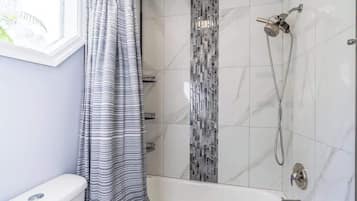 Shower, hair dryer, towels, shampoo