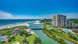A coastal hotel with a beach view, a swimming pool, and a river. - Luxury Oceanfront 4 Bedroom Condo: Sleeps 12 (North Myrtle Beach)