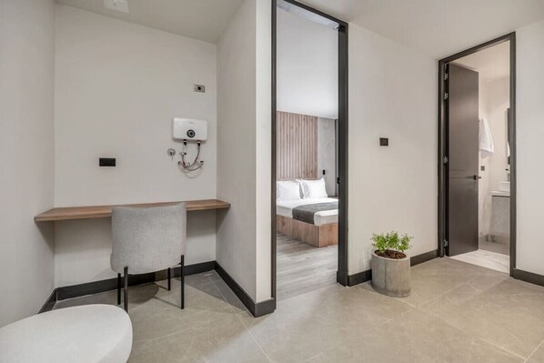 1 bedroom, desk, iron/ironing board, travel crib