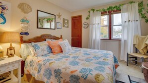 A bedroom with a bed, a chair, a lamp, and a window with curtains. - Harmony Home w/ Fire Pit: 5 Mi to Niagara Cave! (Harmony)