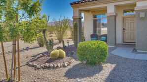 A house with a patio area, a cactus, and a small tree. - Corona De Tucson Home With Hot Tub! (Vail)