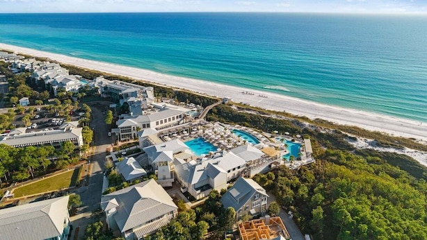 An aerial view of a resort with a large pool, beachfront, and ocean views. - WaterColor! Steps to Seaside, WC Tennis! LSV/Golf Cart & 2 Bikes Included! Secluded but Central! (Santa Rosa Beach)