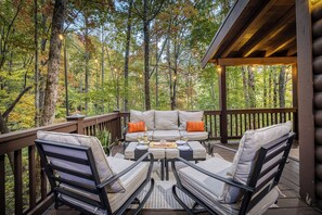 Terrace/patio - Wooded Cabin · Hot Tub + Arcade · Fire Pit (Cherry Log)