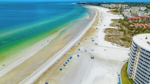 An aerial view of a beach with a hotel adjacent to it. - Beautiful Beach View Condo At Crystal Sands on Siesta Key! (Siesta Key)