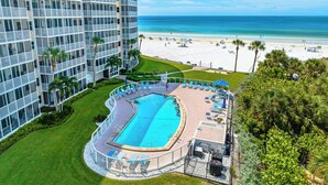 A hotel with a pool, beach view, and a high-rise building. - Beautiful Beach View Condo At Crystal Sands on Siesta Key! (Siesta Key)