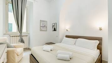 1 bedroom, desk, iron/ironing board, travel crib