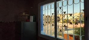 Enjoy a view of the surrounding area from the large window with decorative bars.