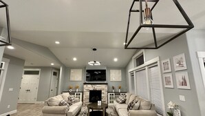 A modern living room with two sofas, a coffee table, and a fireplace. - House in West Salem (Salem)