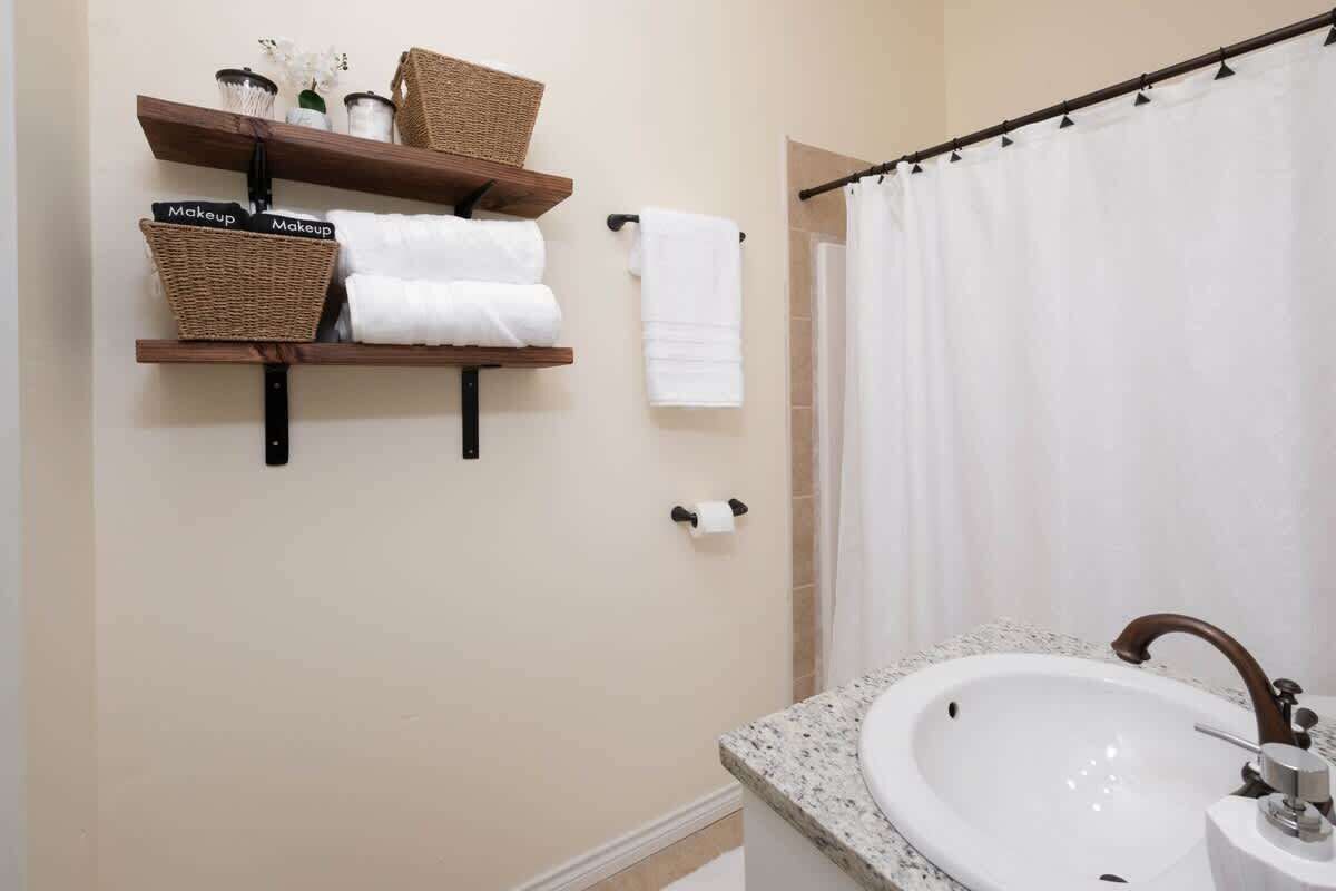Shower, hair dryer, towels, shampoo