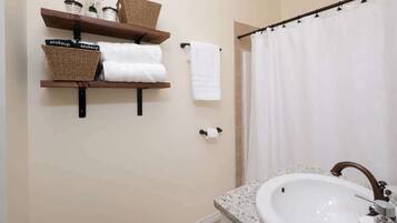 Shower, hair dryer, towels, shampoo