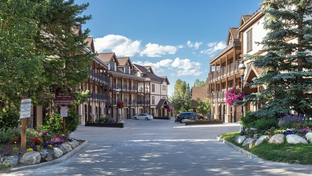 A street view of a town with buildings on both sides, a clear sky, and a road in the center. - The Corral at Breckenridge #206S By Summit County Mountain Retreats (Breckenridge)