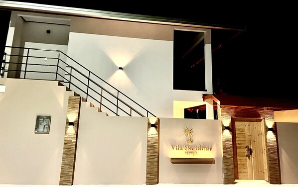 A modern building with a staircase, a sign reading "Villa Residence," and a large window. - Vilu Residence (Maamigili)