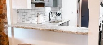 Cheerful 2 bedroom home with indoor fireplace.