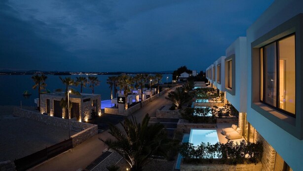 A coastal hotel with a pool, outdoor seating, and a view of the sea. - Awesome home in Tkon-Ugrinic (Tkon-Ugrinic)