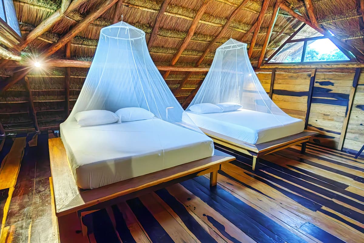Deluxe Bungalow, 2 Queen Beds, Terrace, Mezzanine | 1 bedroom, pillowtop beds, free minibar, laptop workspace