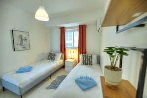 2 dormitorios, tabla de planchar con plancha, wifi gratis y ropa de cama