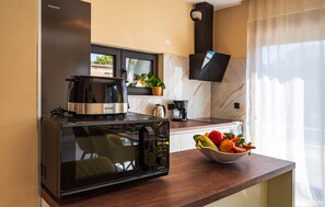 Fridge, microwave, dishwasher, coffee/tea maker