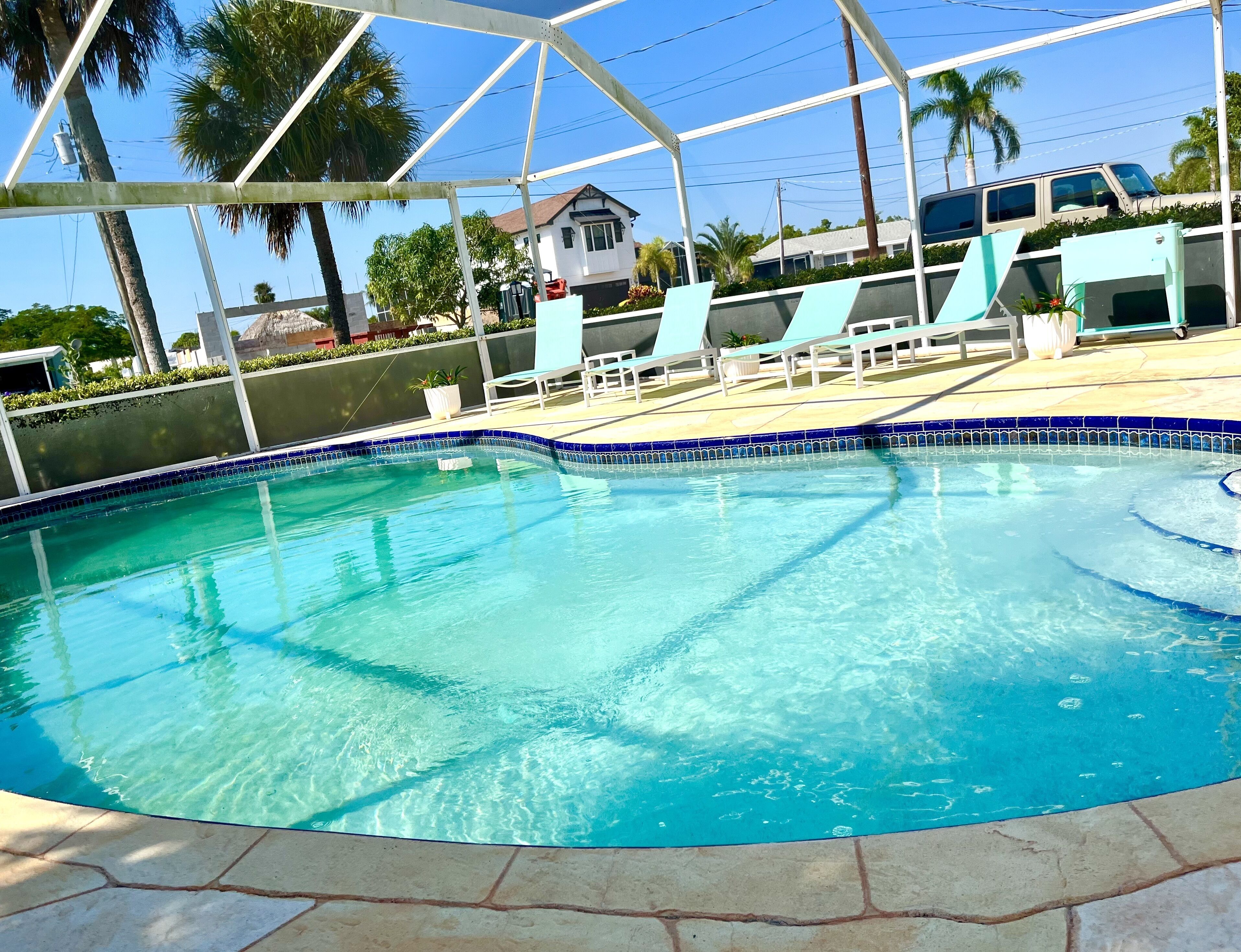 Midcentury 3/2 pool home with dock, canal access to Gulf, minutes from Fifth Ave