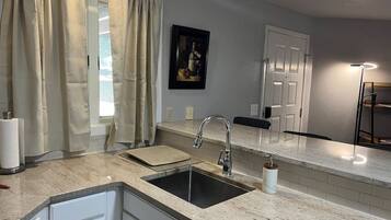 Fridge, coffee/tea maker, cookware/dishes/utensils